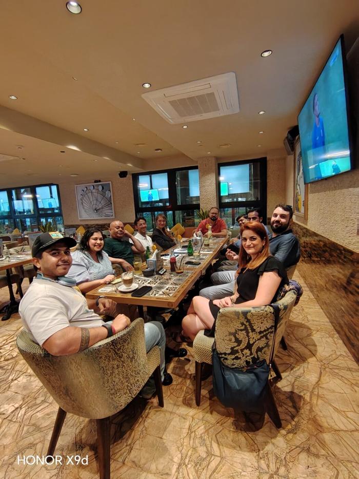 Large United Expats in UAE group meetup at a cafe